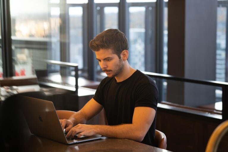 Developer sending cold pitch email with response-rate metrics overlay.