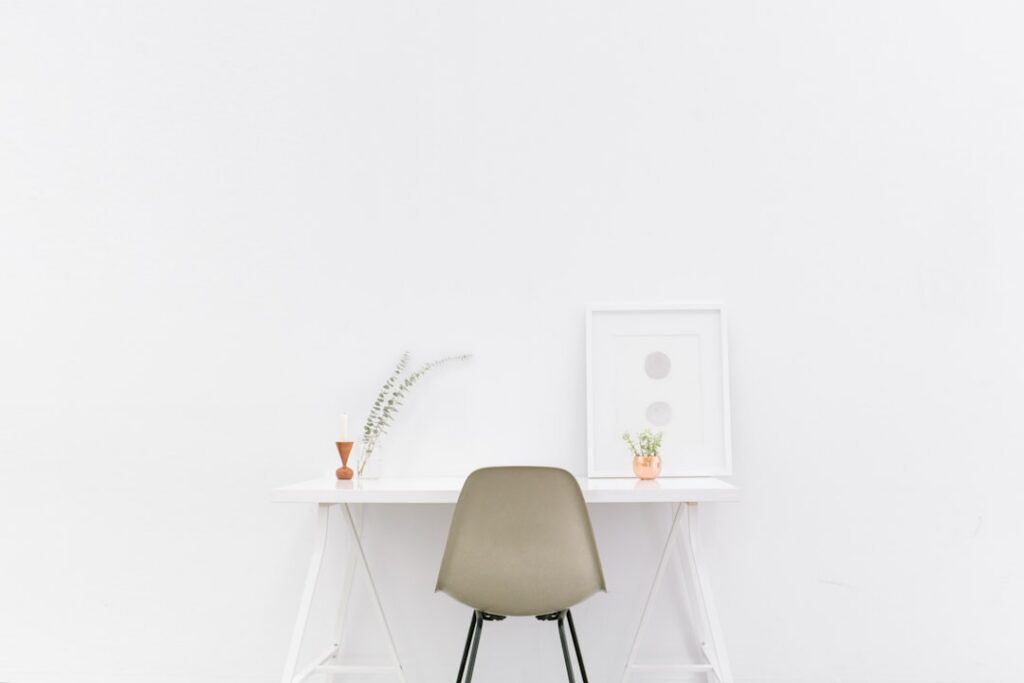 Minimalist white workspace desk for senior developer negotiation