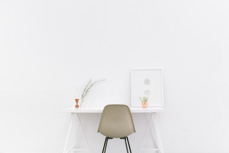 Minimalist white workspace desk for senior developer negotiation