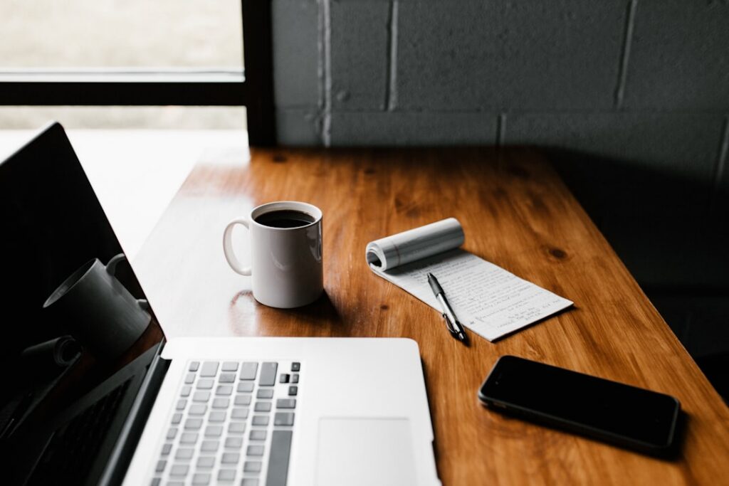 Remote B2B contractor workspace with laptop and coffee