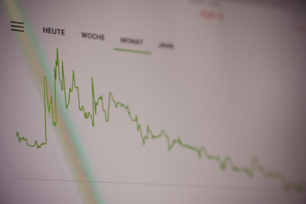 Declining bar chart for junior developer jobs with upward arrows for pivot strategies on dark background